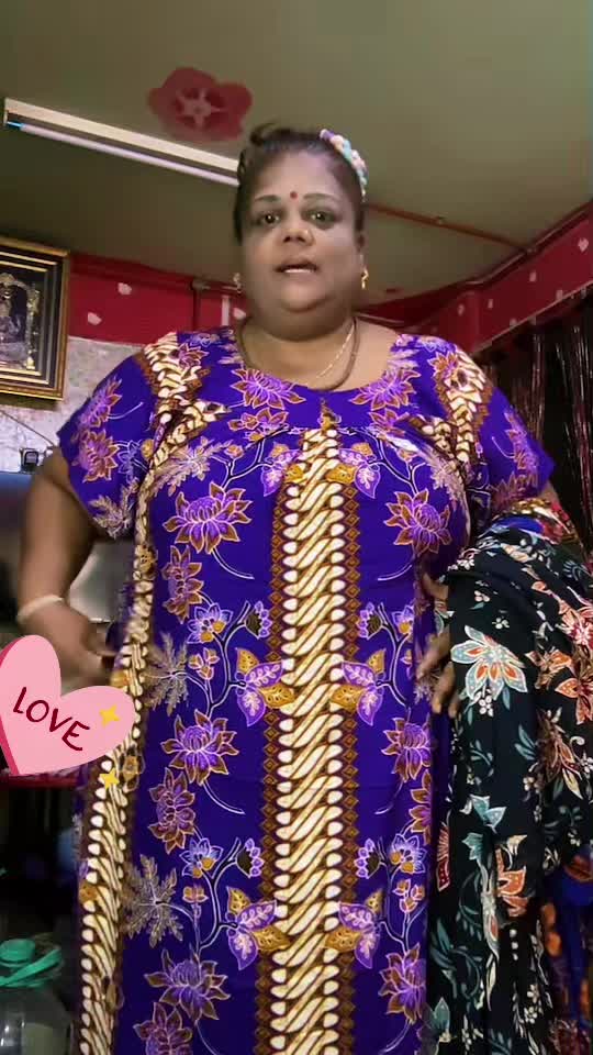 The woman introduces the purple nightgown she is wearing, showing the cut, cuff… TikTok video