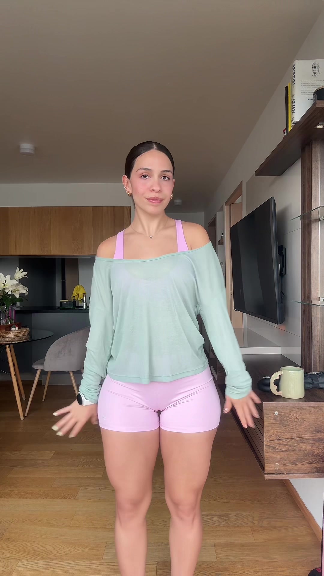 I'm going to show you the three ways you can wear this sweater-style blouse. TikTok video